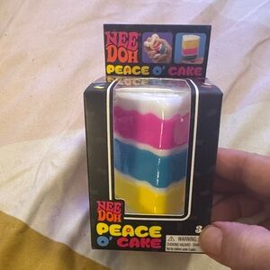 NeeDoh Peace O' Cake Kids Toy - Pink, Blue, Yellow & White